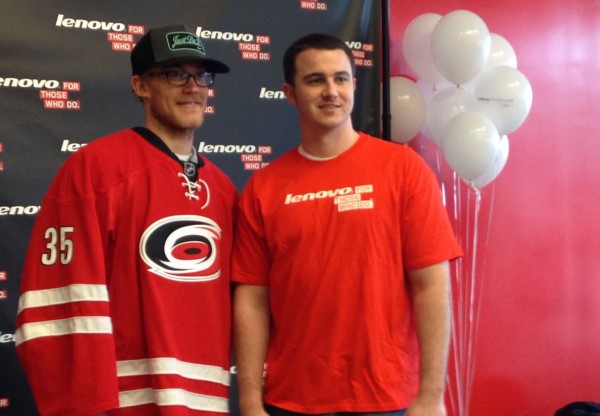 Hurricane's Goaltender Justin Peters posed with fans at Lenovo for photos during the E-Cycling event