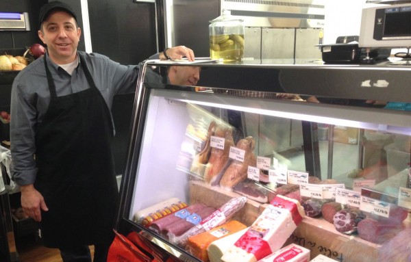 Cary store general manager Jeff Gregory beside the deli counter